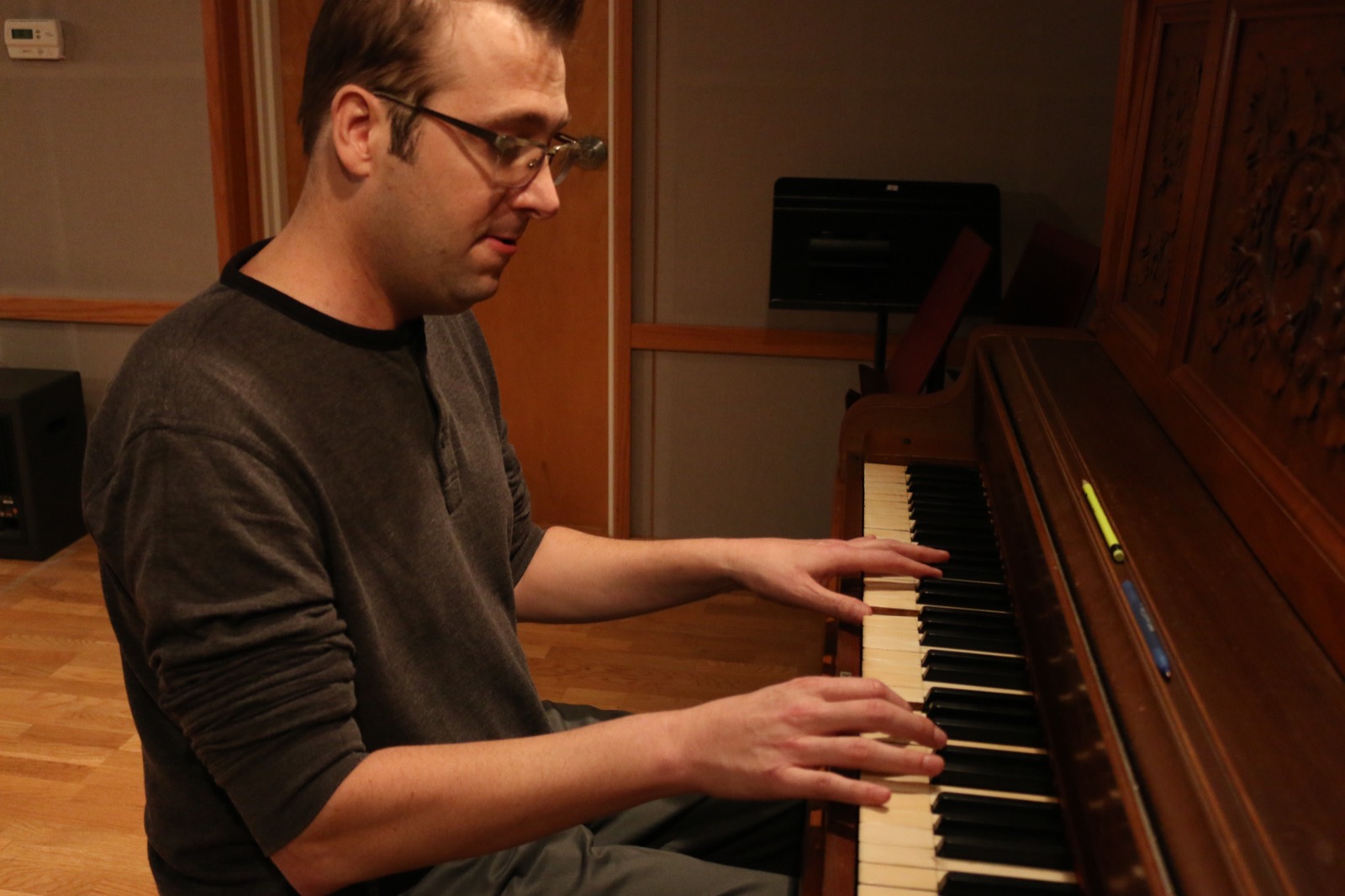 Dave Tough playing piano in the studio