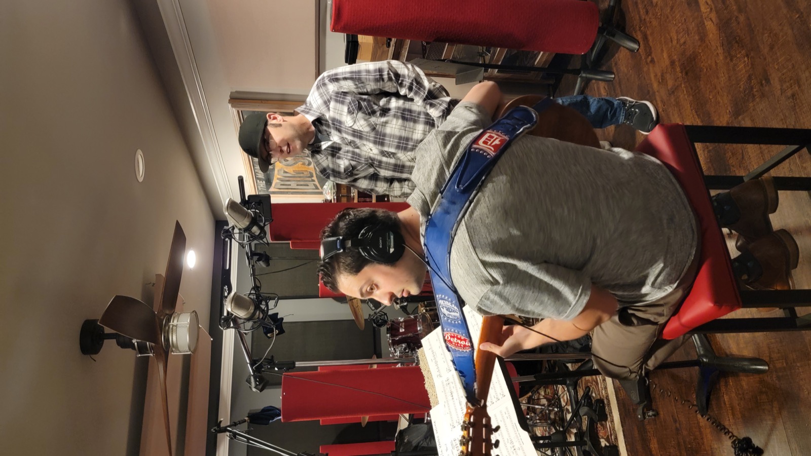 Dave Tough directing musicians during a session